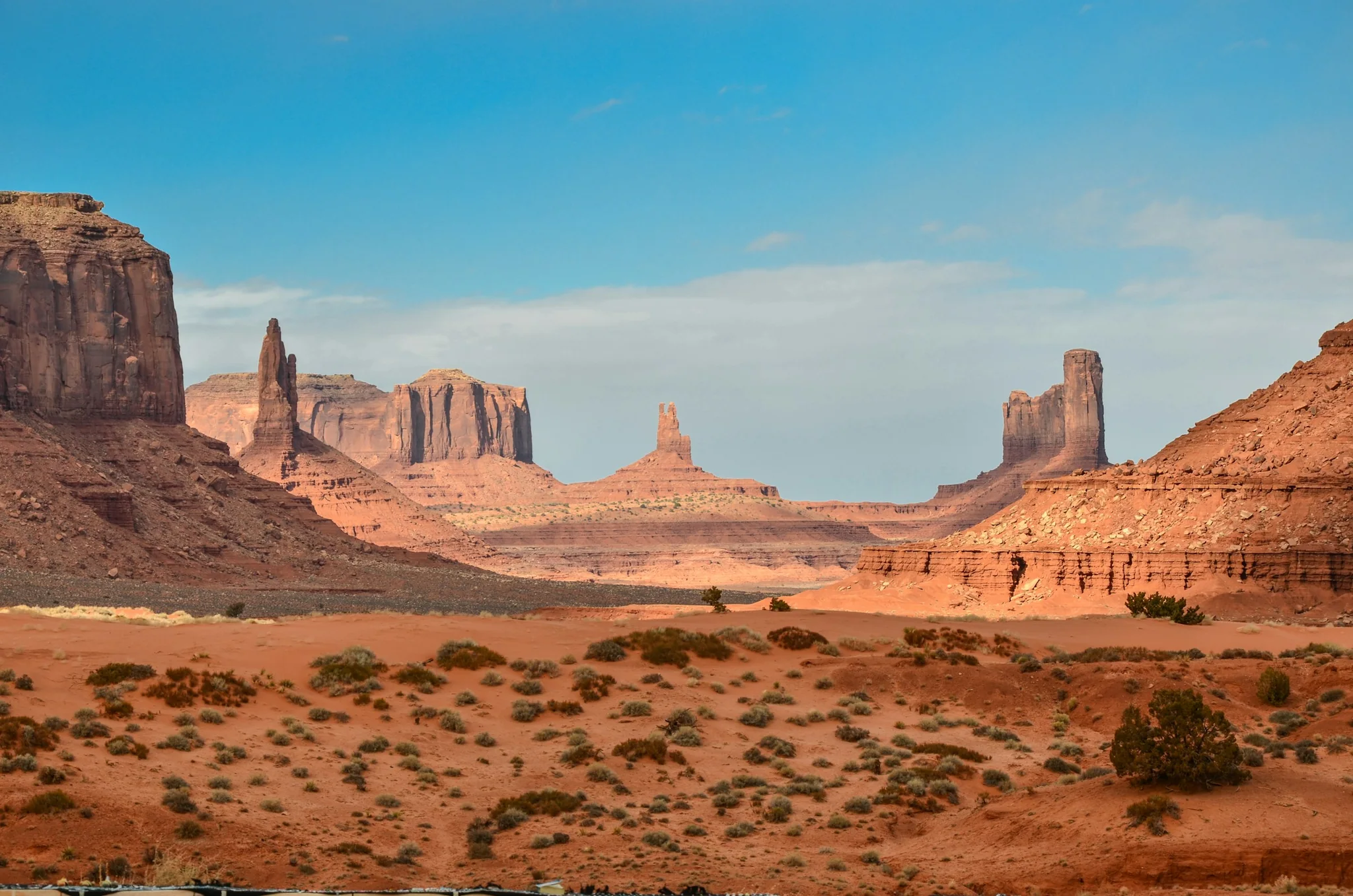 Curving sand dune ridge beneath a clear sky