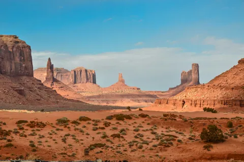 Curving sand dune ridge beneath a clear sky